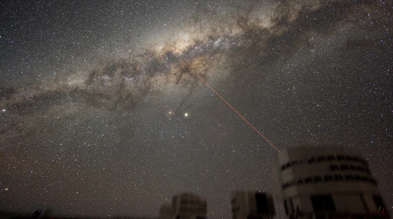 The Milky Way galaxy seen face-on, spiral arms glowing.